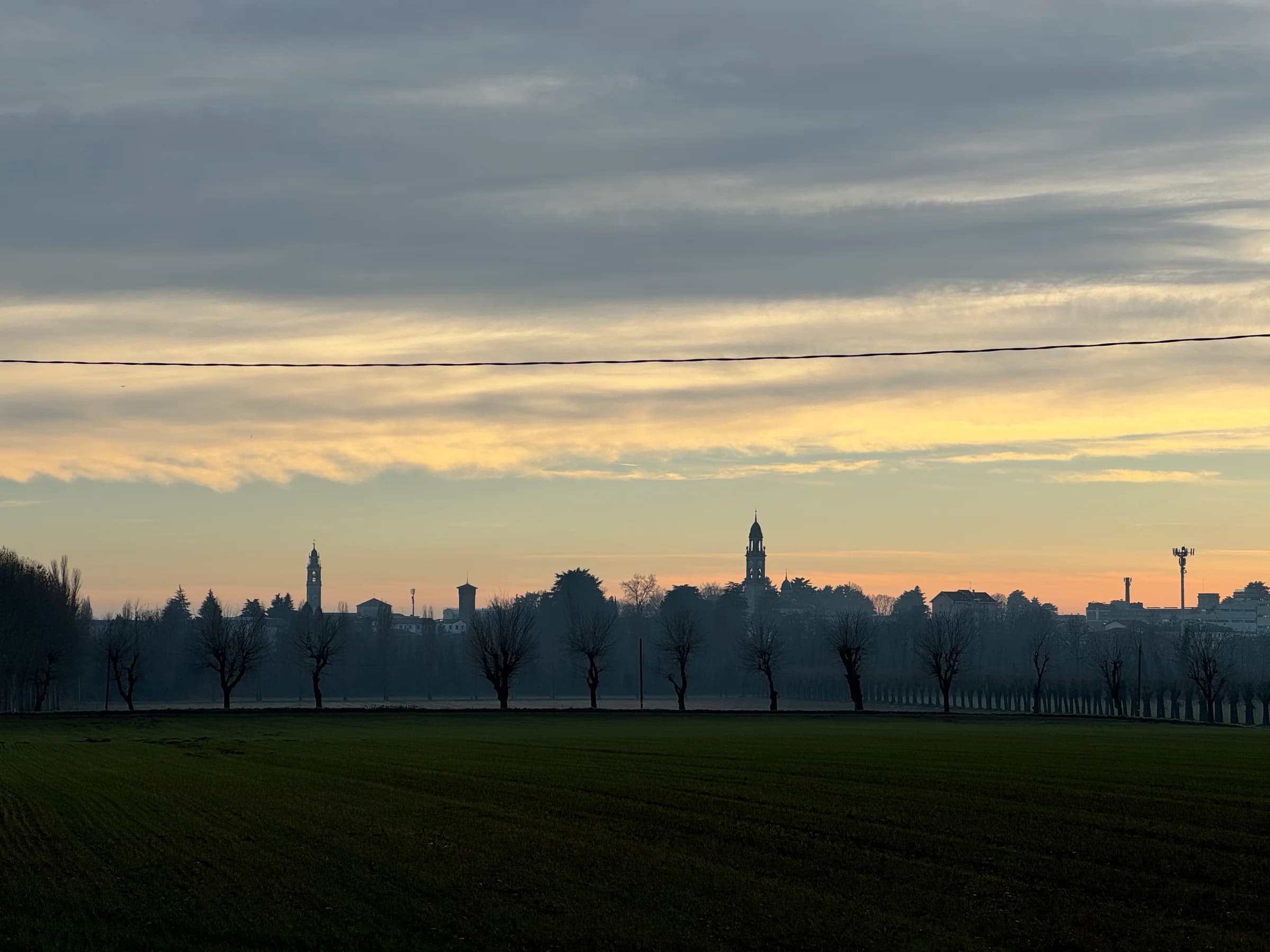 Lomazzo’s skyline at sunset, from the Quadrato fields